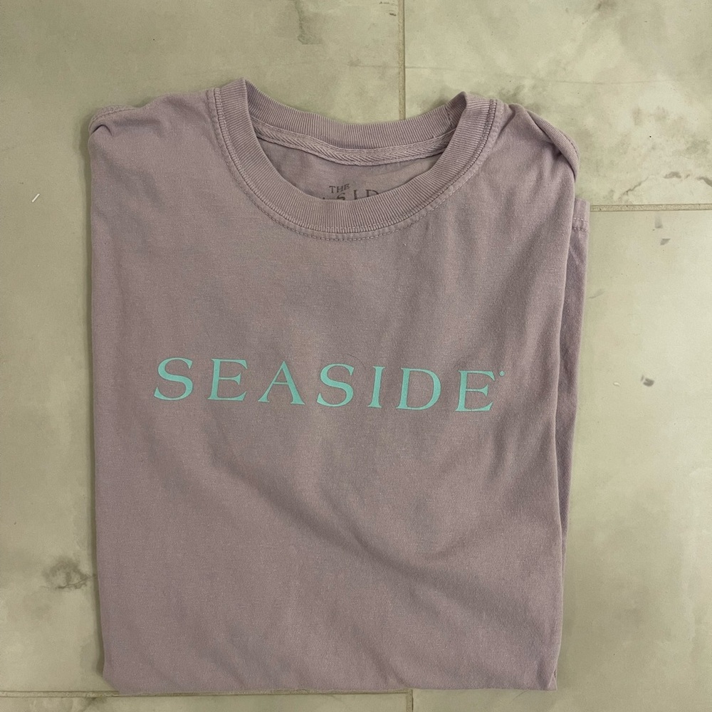 Purple seaside shirt and blue letters
